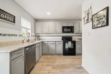 Step into this gorgeous, fully furnished townhome where coastal - photo 1