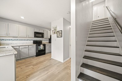 Step into this gorgeous, fully furnished townhome where coastal - photo 3