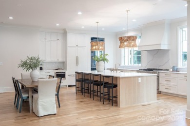 Nestled on nearly half an acre in the heart of prestigious Myers