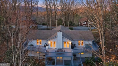 This adorable 4-bedroom, 4.5-bathroom mountain cabin is located - photo 2