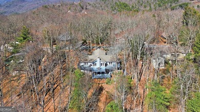 This adorable 4-bedroom, 4.5-bathroom mountain cabin is located - photo 3