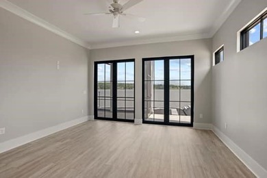 Experience panoramic lake living at its finest. This