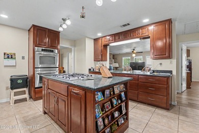 Beautiful Deep Waterfront home with a large pier and covered - photo 11