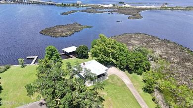 Beautiful Deep Waterfront home with a large pier and covered - photo 34