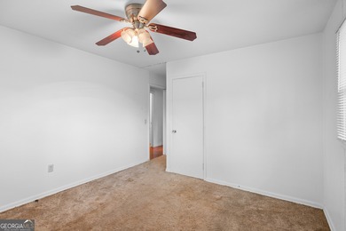 This four-sided brick, one-level home offers 3 bedrooms and 1.5