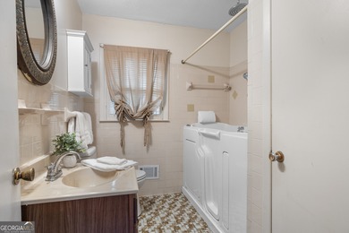 This four-sided brick, one-level home offers 3 bedrooms and 1.5