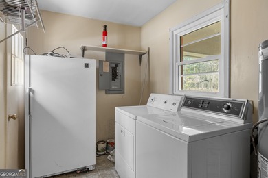 This four-sided brick, one-level home offers 3 bedrooms and 1.5