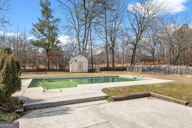 This four-sided brick, one-level home offers 3 bedrooms and 1.5