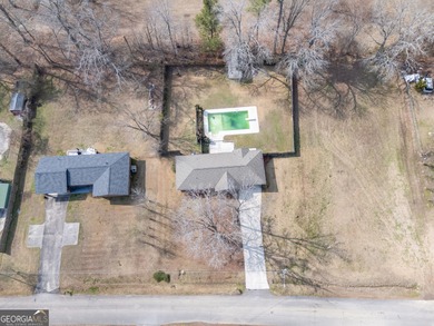 This four-sided brick, one-level home offers 3 bedrooms and 1.5