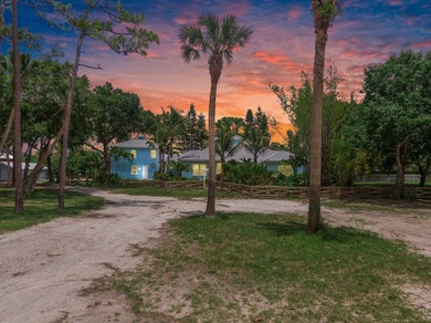 Experience timeless luxury and laid-back elegance on this gated - photo 1