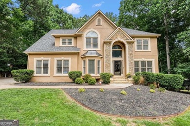 Welcome home to this spacious four-bedroom - photo 1