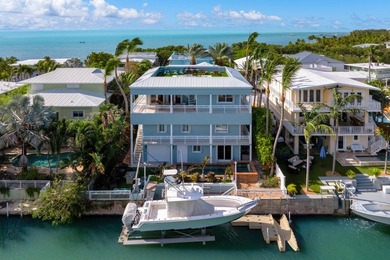 Stunning Plantation Key canal front pool home! This exceptional - photo 44