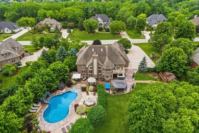 Nestled on a breathtaking lot, this CUSTOM home offers luxurious - photo 8