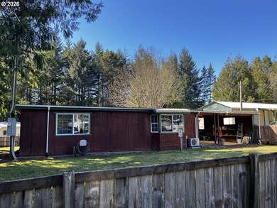 This charming 2-bedroom, 1-bath manufactured home sits on a - photo 1
