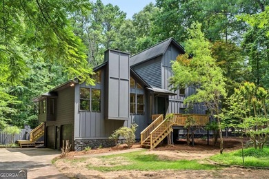 Welcome to this stunning, completely renovated home nestled on a - photo 1
