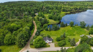 Set along the shore of Meadow Pond on Islesboro, this - photo 42