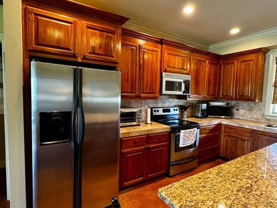 This exquisite four-bedroom camp, complemented by an attached - photo 4