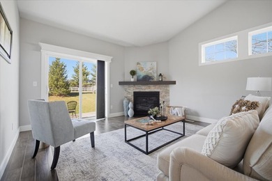 Gorgeous zero-lot home with wood flooring throughout main level