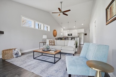 Gorgeous zero-lot home with wood flooring throughout main level