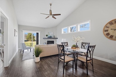 Gorgeous zero-lot home with wood flooring throughout main level