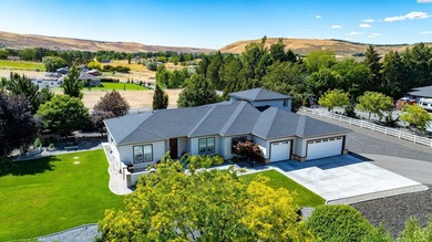 MLS# 293826 Perched on a beautifully landscaped homesite with - photo 3