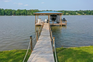 Positioned on a spectacular 2.4 acre lot with 267-foot lakefront - photo 12