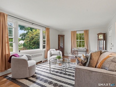 Welcome home to this charming Cape nestled in a sought-after - photo 3