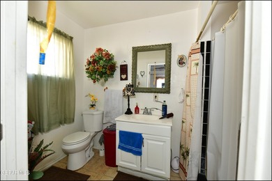 This well-maintained three-bedroom, one and three-quarter bath