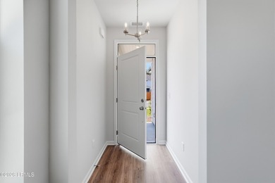 This two-story home includes three bedrooms and two-and-one-half - photo 4