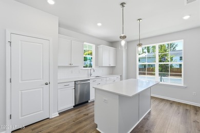This two-story home includes three bedrooms and two-and-one-half - photo 6