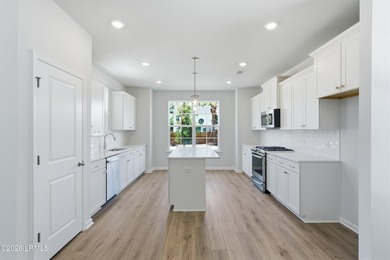 This two-story home includes three bedrooms and two-and-one-half - photo 7