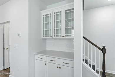 This two-story home includes three bedrooms and two-and-one-half - photo 10