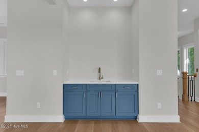 Experience elevated coastal living at 1624 Sunrise Lane in