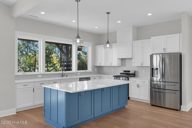 Experience elevated coastal living at 1624 Sunrise Lane in