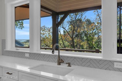 Experience elevated coastal living at 1624 Sunrise Lane in