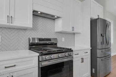 Experience elevated coastal living at 1624 Sunrise Lane in