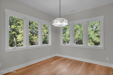 Experience elevated coastal living at 1624 Sunrise Lane in