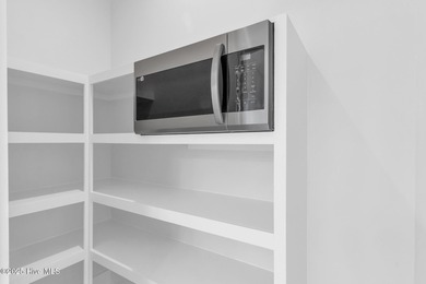 Experience elevated coastal living at 1624 Sunrise Lane in