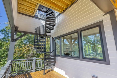 Experience elevated coastal living at 1624 Sunrise Lane in