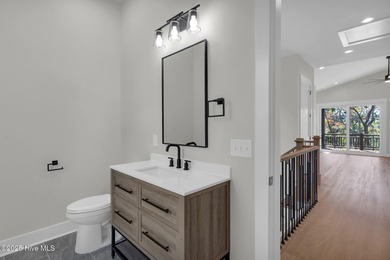 Experience elevated coastal living at 1624 Sunrise Lane in