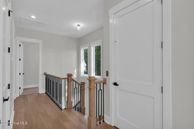 Experience elevated coastal living at 1624 Sunrise Lane in