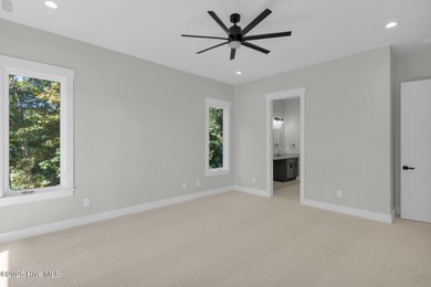 Experience elevated coastal living at 1624 Sunrise Lane in