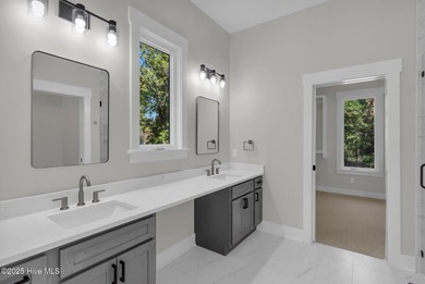 Experience elevated coastal living at 1624 Sunrise Lane in