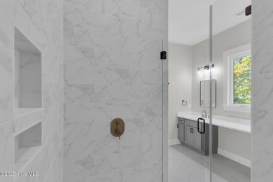 Experience elevated coastal living at 1624 Sunrise Lane in