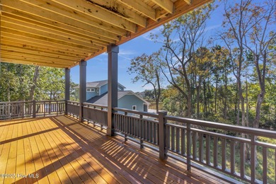 Experience elevated coastal living at 1624 Sunrise Lane in