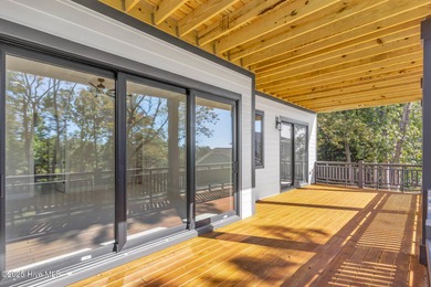 Experience elevated coastal living at 1624 Sunrise Lane in