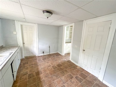 This spacious 4-bedroom, 1.5-bath Colonial in the City of - photo 6