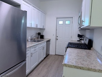 Welcome to this exceptional, fully renovated two-family - photo 11