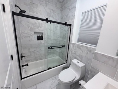 Welcome to this exceptional, fully renovated two-family - photo 15