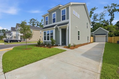 This two-story home includes three bedrooms and two and one-half - photo 2